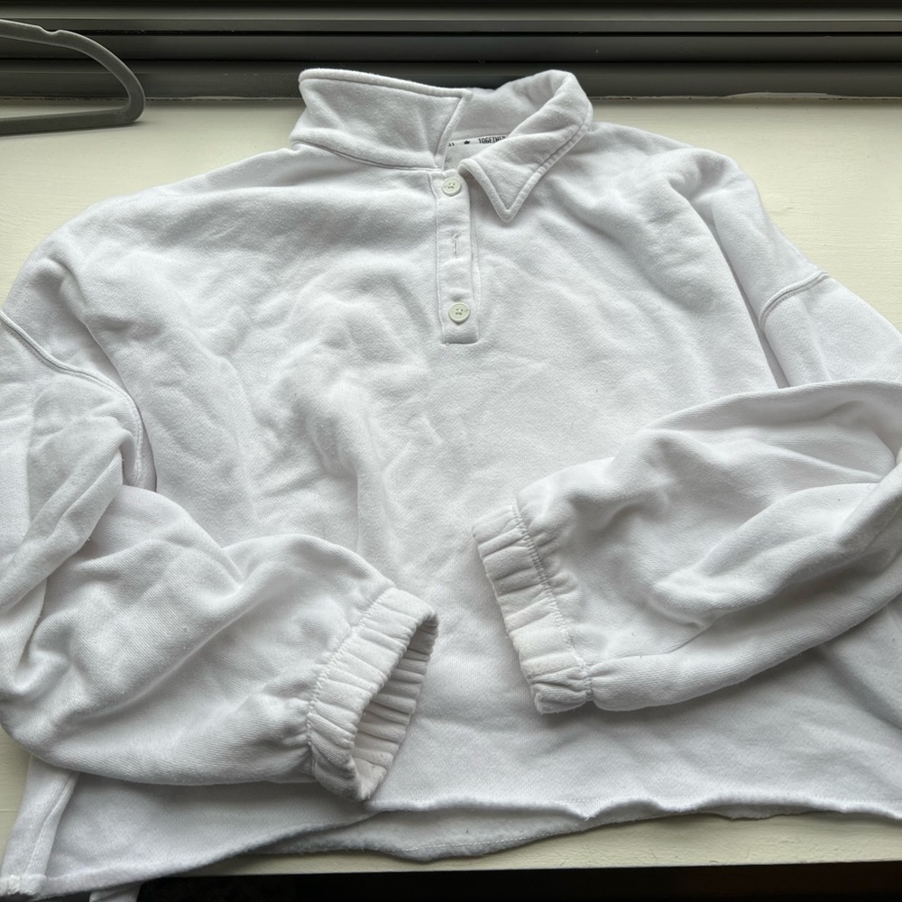 Cropped, cuffed, and collared white sweatshirt